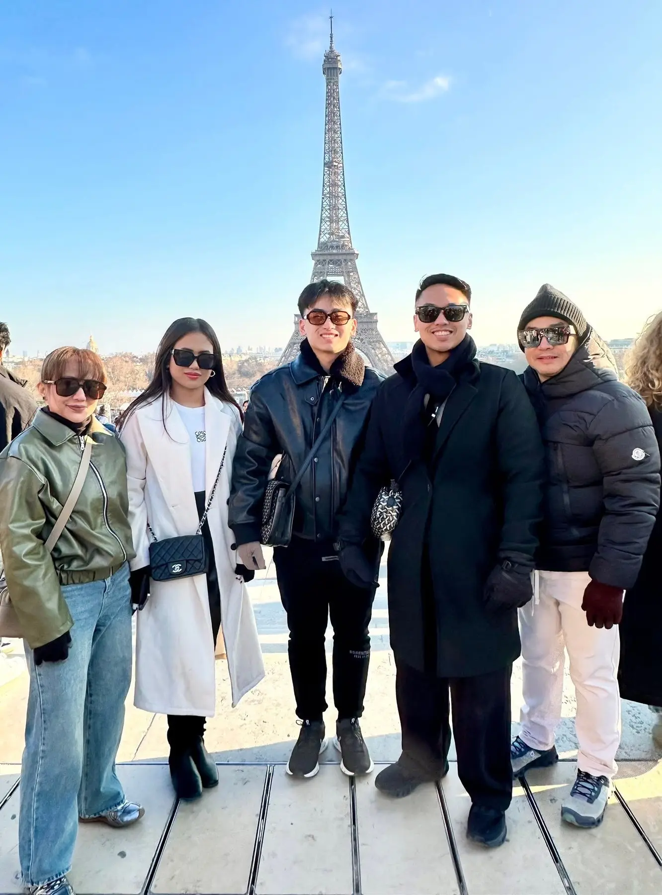 EJ with his family near the Eiffel Tower